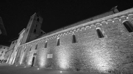 Beautifully lit Pisa church at night close to Via Santa Maria showcasing classic architecture © jovannig