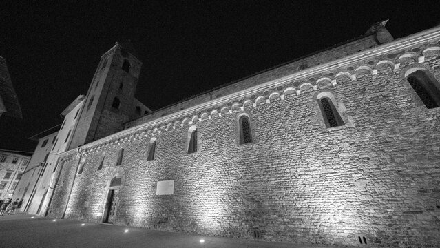 Beautifully lit Pisa church at night close to Via Santa Maria showcasing classic architecture