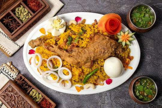 Delicious Traditional Chicken Khichuri Platter With Boiled Egg And Spices