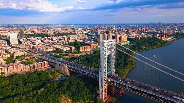 Scenic view on Washington Heights in Upper Manhattan across the Hudson River toward Fort Lee, New Jersey. Drone footage near the George Washington Bridge at sunset.