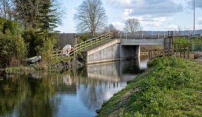 Fototapeta premium Restored (2025) section of the Stroudwater Navigation at Whitminster looking towards Stroud. Part of the 'Cotswold Canals Connected' restoration project, Stroud, Gloucestershire, United Kingdom
