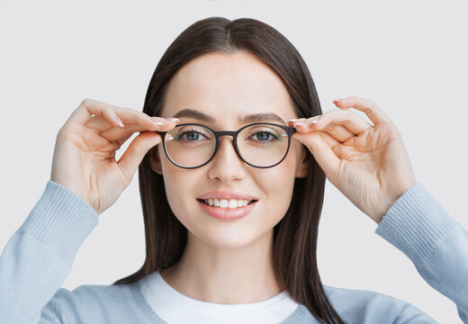 Young beautiful woman wearing glasses closeup isolated portrait. Student girl studio shot, Young businesswoman smiling indoor, People, beauty, student lifestyle, business concept