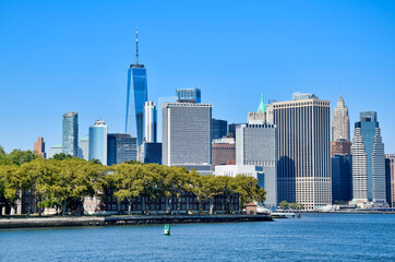 Blue two-masted schooner sailing vessel docked at pier with warehouse and Brooklyn skyline in background, New York Harbor, NYC, USA © AMTravelPhotographer