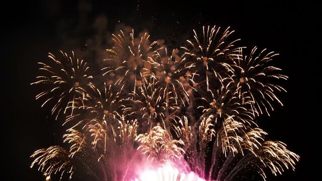 Spectacular Fireworks Display at Night with Bursting Red, Gold and White Effects