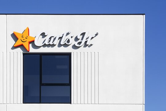 Horsens, Denmark - March 15, 2025: Carl's jr logo on a wall. Carl's jr is an American fast food restaurant chain operated by CKE Restaurant Holdings, Inc