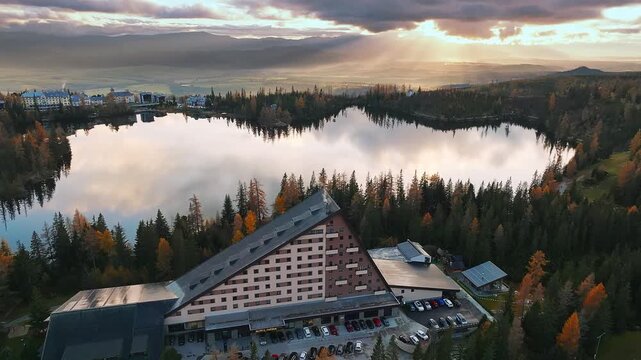Strbske Lake, Slovakia - 4K Flying above Strbske Lake (Strbske Pleso) on a sunny autumn afternoon at sunset. Sunlight, clouds, warm colors