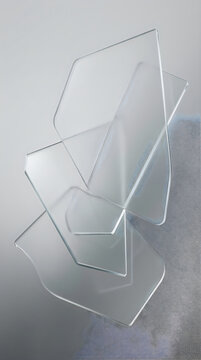 Abstract composition of overlapping transparent glass plates with soft edges, arranged in a geometric layered structure against a light grey background with textured fabric uiux background