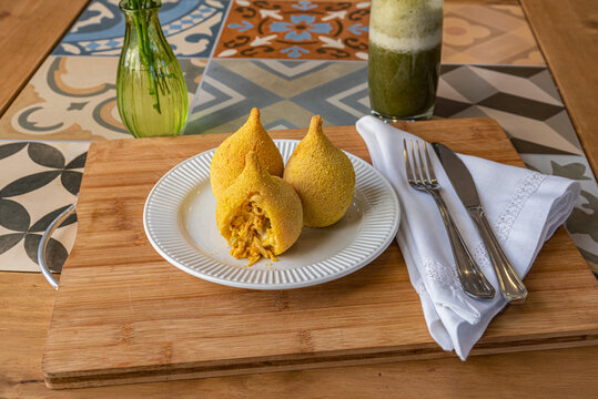 Brazilian coxinha de frango - chicken snack on table