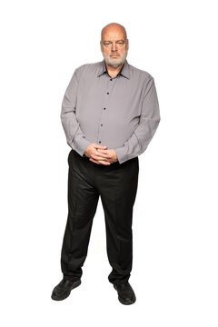 Full Length Portrait of Serious 55 Year Old Man in Grey Shirt and Black Pants