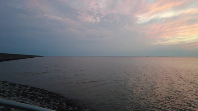 Sunset at Norderhafen (northern harbor) of the Nordstrand peninsula at the Wadden Sea National Park in Schleswig-Holstein, Germany, Europe