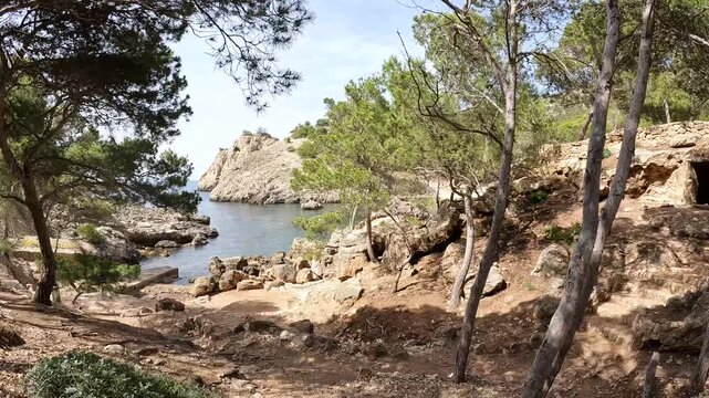 POV Walk Down a Steep Rocky Coastal Path Arriving at a Secluded Cove, Mallorca, Spain