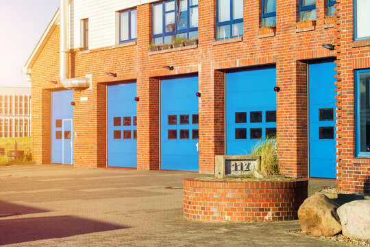 Brick Fire Station Building with Bright Blue Garage Doors, Emergency Infrastructure