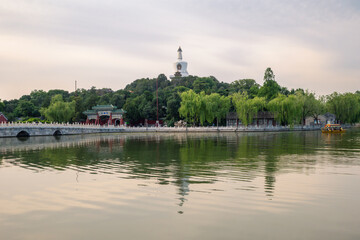 Fototapeta premium Iconic White Pagoda situated on Qionghua Island within Beihai Park in Beijing. Beihai Park is one of the oldest imperial gardens in China, located just northwest of the Forbidden City.
