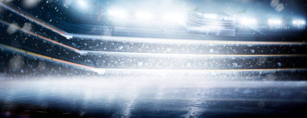 Professional hockey stadium. Ice. Hockey stadium view. Rink. Professional sports background for advertisement with lights, fans and flags. Big sport © Ruslan Shevchenko