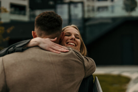 Happy couple embracing, showing love and affection outdoors