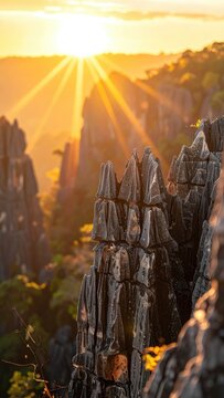 Dramatic sunset illuminating sharp rock formations with golden light