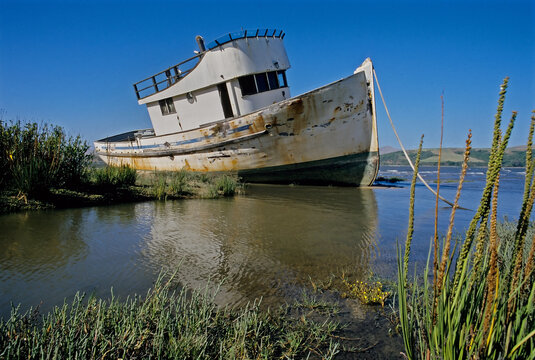 Abandoned boat on tidal flats.