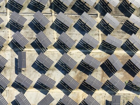 Rows of solar panels at a photovoltaic plant near Vejer de la Frontera. Aerial view. Drone shot. C&aacute;diz province, Andalusia, Spain