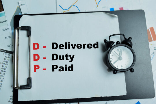 Concept of DDP - Delivered Duty Paid write on clipboard isolated on Wooden Table.