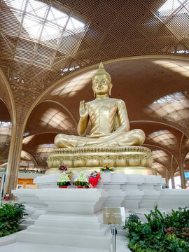 Phnom Penh, Cambodia - February 7, 2026: A large golden Buddha statue sits inside Techo International Airport departure lounge in Phnom Penh, Cambodia.