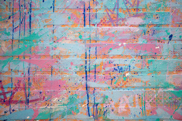 Background abstract painted brick texture. Background colorful urban wall pattern. Background creative graffiti surface design. Background modern artistic backdrop. © Volodymyr