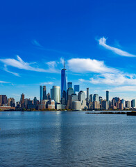 Fototapeta premium New York city skyline panorama. New York waterfront beside harbor. New York City buildings with NYC. New York skyscrapers near downtown.
