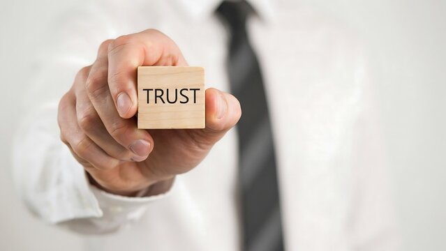 Businessman Holding Wooden Block With Trust Text Corporate Integrity Values Concept
