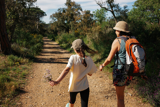 Grandmother and child Walk Along Mediterranean landscape