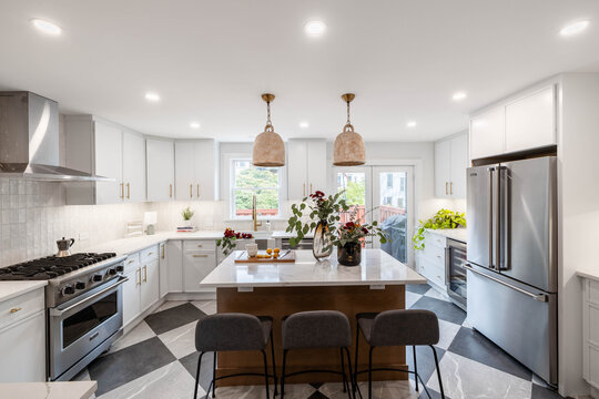 Modern White Kitchen with Marble Island, Gray Bar Stools and Checkered Floor