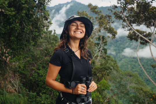 Young female birdwatcher portrait