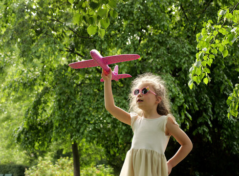 A girl with a model aeroplane