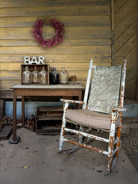 Display of vintage items behind an old building at the long-abandoned railroad depot of Cohasset, Virginia.