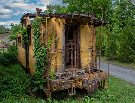 Abandoned and delapidated old railroad caboose at the Cohasset Depot in rural Virginia
