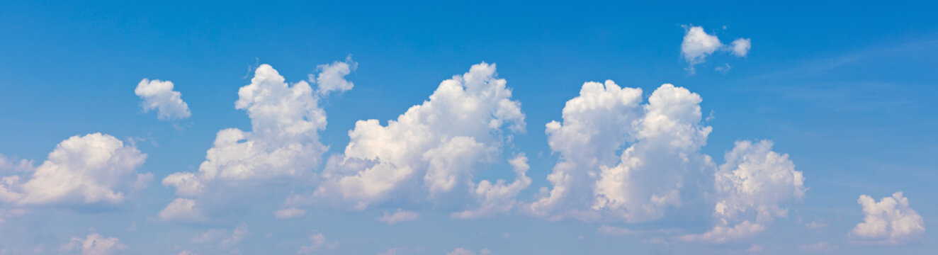 Panorama of a blue sky with white clouds