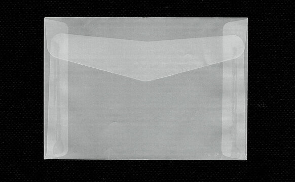 Closed translucent vellum envelope isolated on black background