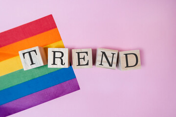 Fototapeta premium LGBTQ Trend Concept with Rainbow Flag and Wooden Blocks