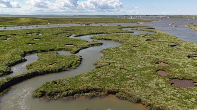 Low flight over tidal channels in Blakeney National Nature Reserve, UK