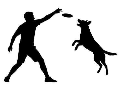 Silhouette of a man throwing a frisbee for a dog catching it mid-air
