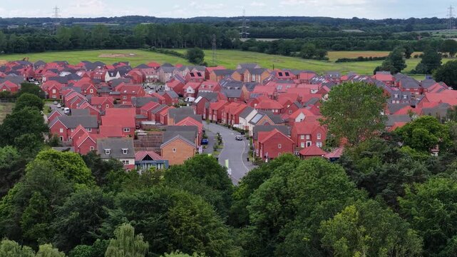 Generic view of red roof housing estate in small English town, United Kingdom