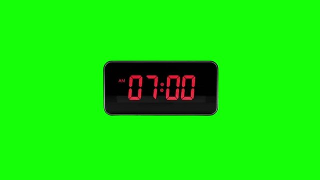 Digital alarm clock at 07:00 AM on green screen background. Red LED display electronic clock isolated for chroma key video overlay.