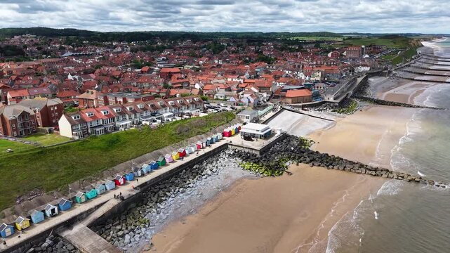 Aerial view of beach huts along Sheringham coastline, Norfolk, United Kingdom