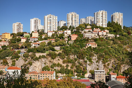 Rijeka, Croatia: A view of the hill with the modern high-rises, residential buildings that stand like contemporary coastal skyscrapers behind the port area on the Adriatic sea.