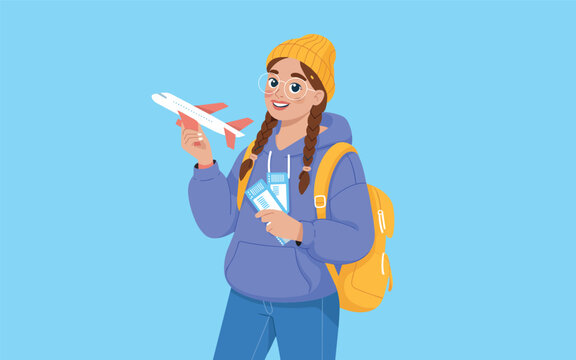 Woman holding airplane model and travel documents stands smiling