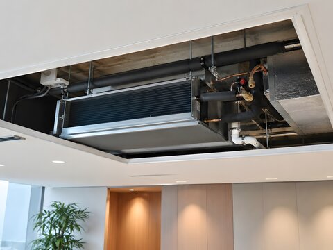 Fan Coil Unit Above a Ceiling Access Panel in a Commercial Building
