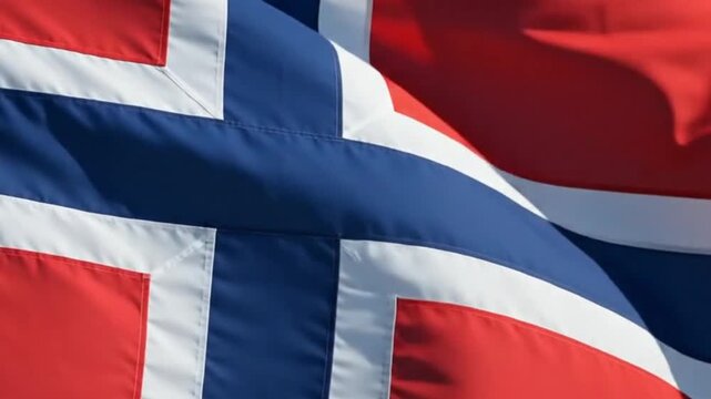 The national flag of norway waving against a clear blue sky