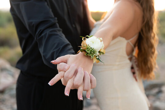 closeup of couple holding hands