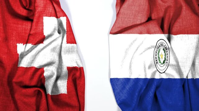 waving colorful flag of switzerland and national flag of paraguay