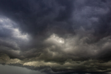 Fototapeta premium Dramatic stormy sky with dark clouds, natural background.