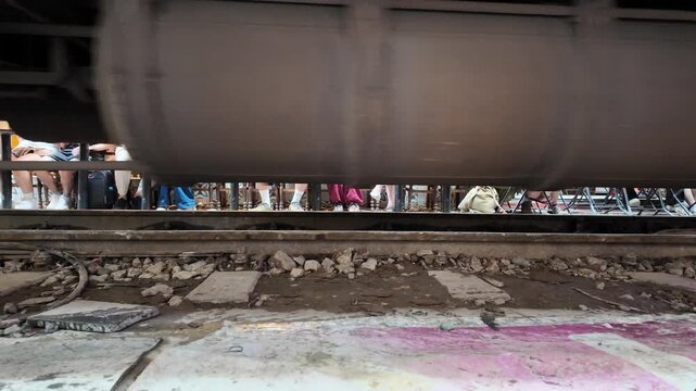 Close-Up of Train Wheels Passing on Railway Track at Hanoi Train Street, Vietnam