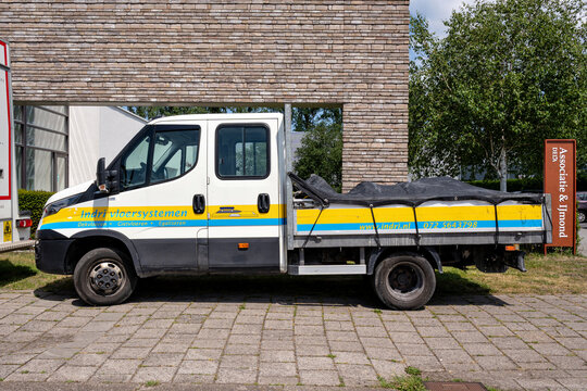 Alkmaar, Netherlands - May 30, 2026: Indri Vloersystemen Iveco Daily crew cab flatbed truck